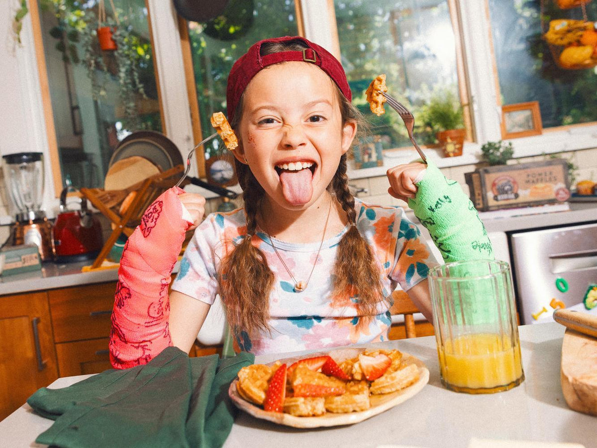 girl eating waffles to show why is breakfast important