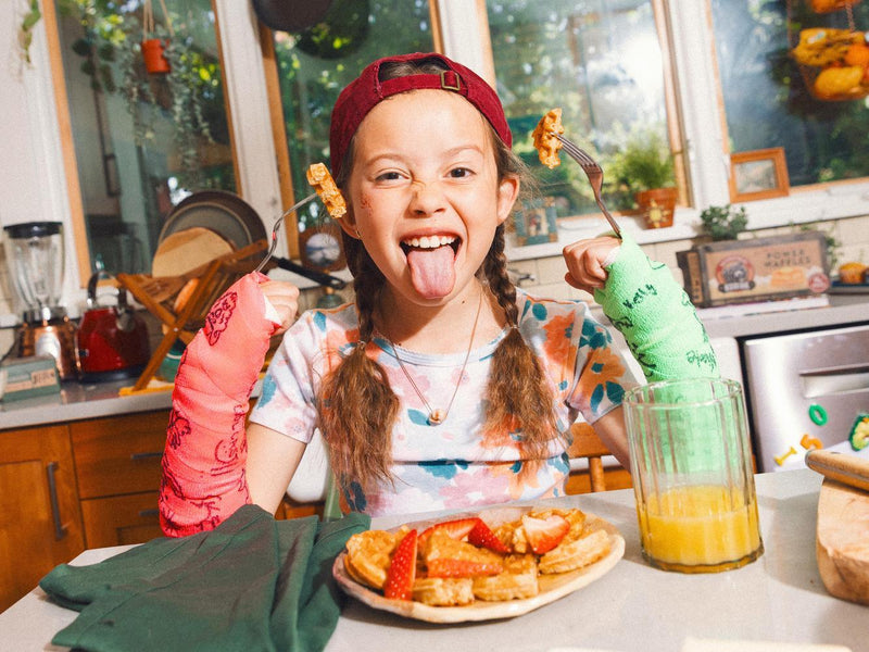 girl eating waffles to show why is breakfast important