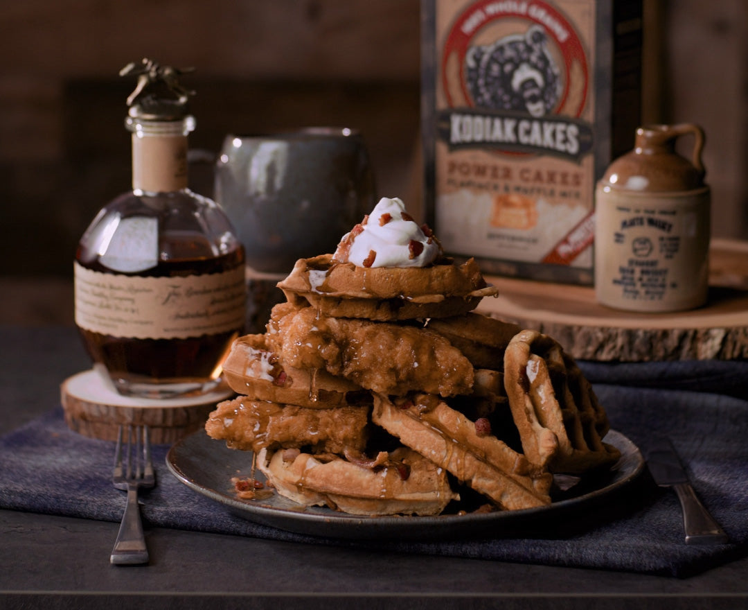 https://kodiakcakes.com/cdn/shop/articles/Maple_Bourbon_Chicken_Bacon_Stuffed_Waffles_1_3913b272-9069-43a6-9c9b-1d3169f861fb_1080x.jpg?v=1643994051